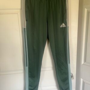 Size Medium Men’s Adidas Aeroready Primegreen style, green with gray stripes.